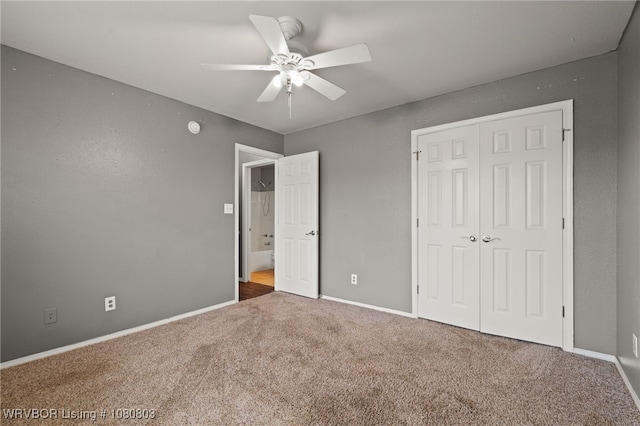 unfurnished bedroom featuring carpet, a closet, baseboards, and a ceiling fan