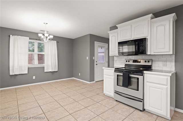 kitchen with black microwave, stainless steel electric range, a chandelier, and baseboards