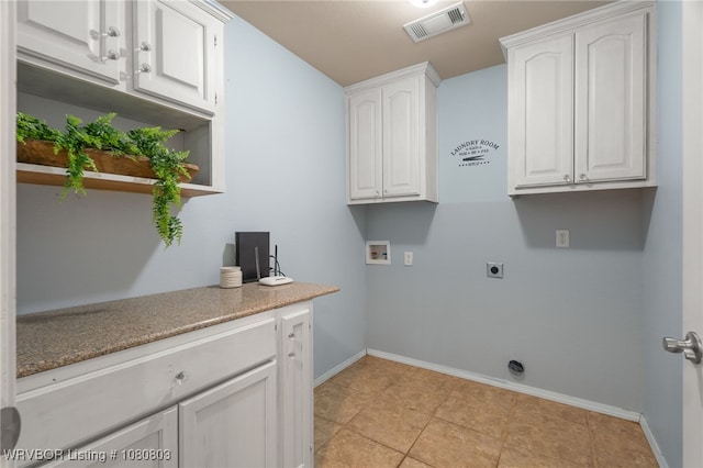 laundry room featuring hookup for a washing machine, cabinet space, hookup for an electric dryer, baseboards, and light tile patterned floors