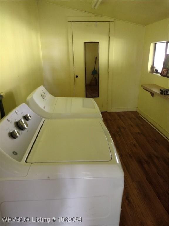 122 N Logan St, Charleston, AR 72933 - laundry area with washer and dryer and dark wood finished floors