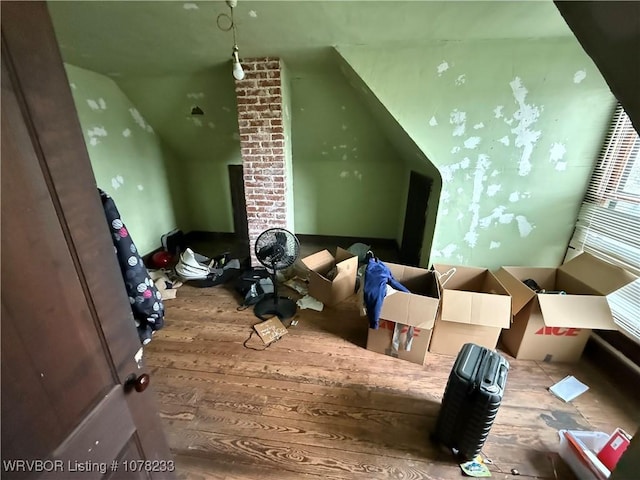 bonus room featuring hardwood / wood-style flooring and lofted ceiling