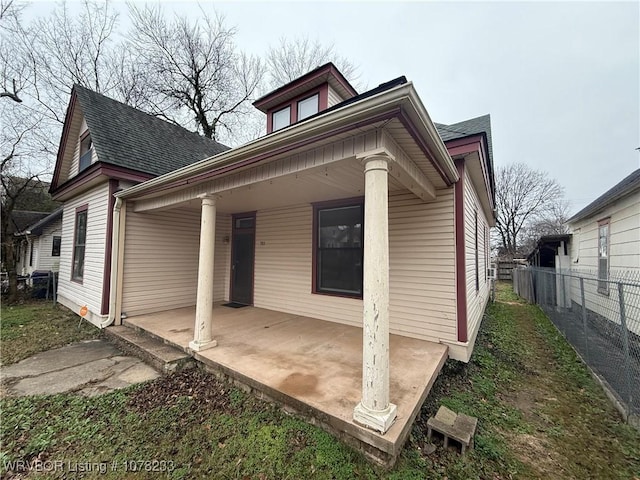 back of property with covered porch