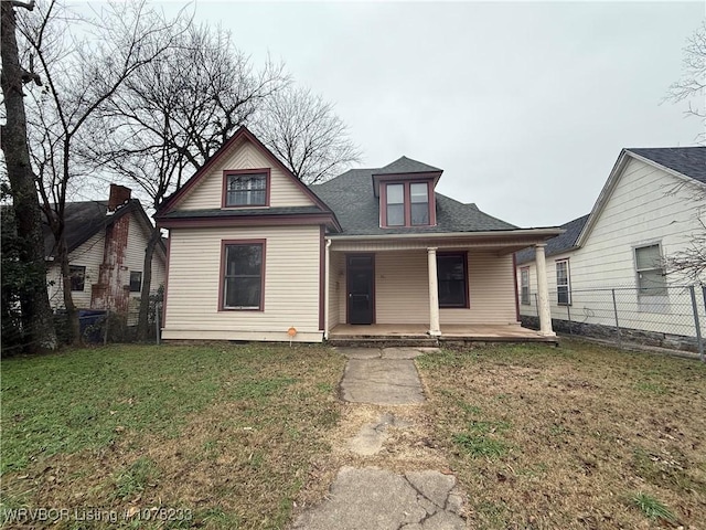 bungalow-style home with a porch and a front yard