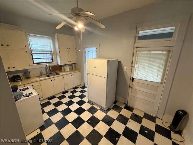 kitchen with ceiling fan, white cabinetry, white appliances, and sink