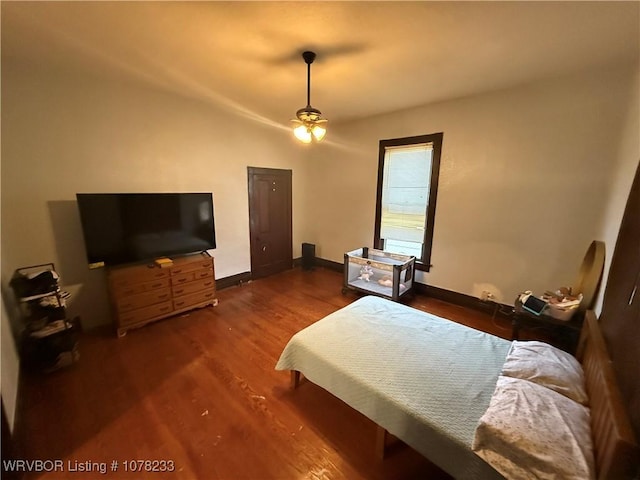 bedroom featuring dark wood-type flooring