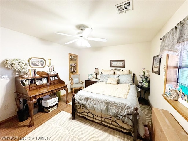 bedroom featuring hardwood / wood-style flooring and ceiling fan