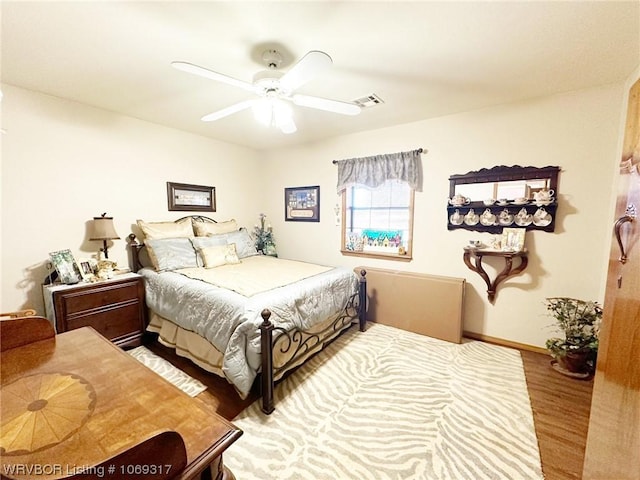 bedroom featuring ceiling fan and wood-type flooring