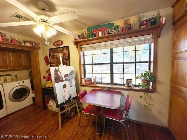 dining room featuring dark hardwood / wood-style flooring, separate washer and dryer, and ceiling fan