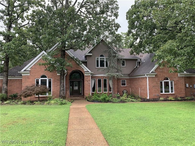 1708 Rannoch Trce, Fort Smith, AR 72908 - traditional-style home with a shingled roof, a front yard, and brick siding