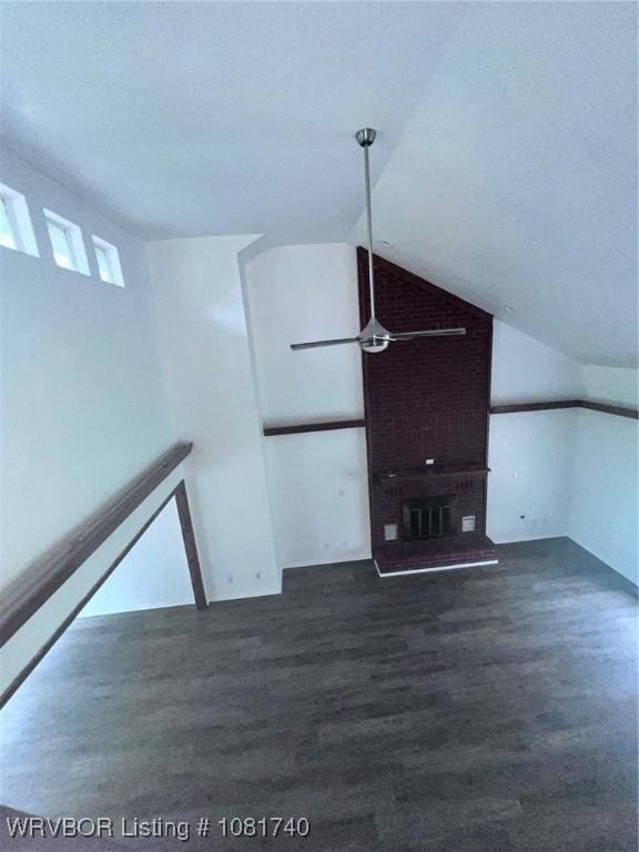 2015 Woodwind Way, Van Buren, AR 72956 - unfurnished living room featuring lofted ceiling, ceiling fan, and dark wood-type flooring
