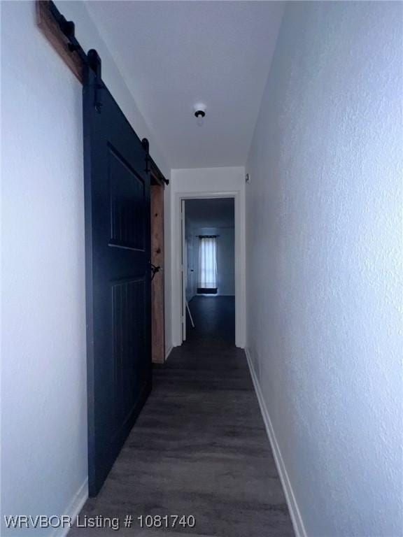 2015 Woodwind Way, Van Buren, AR 72956 - hallway with a barn door and dark wood-style floors