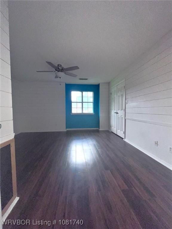 2015 Woodwind Way, Van Buren, AR 72956 - spare room featuring dark wood-type flooring and a ceiling fan