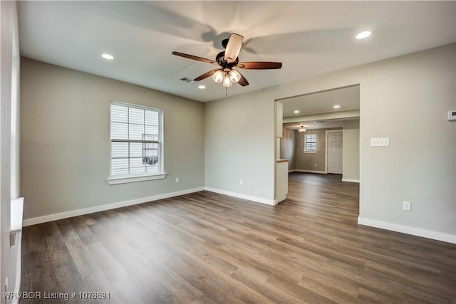 spare room featuring hardwood / wood-style flooring and ceiling fan