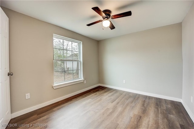 unfurnished room with ceiling fan and hardwood / wood-style floors