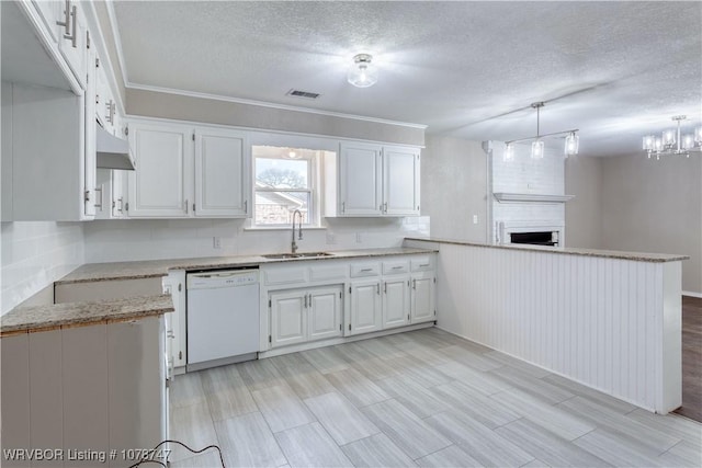 kitchen with white cabinetry, hanging light fixtures, sink, and dishwasher