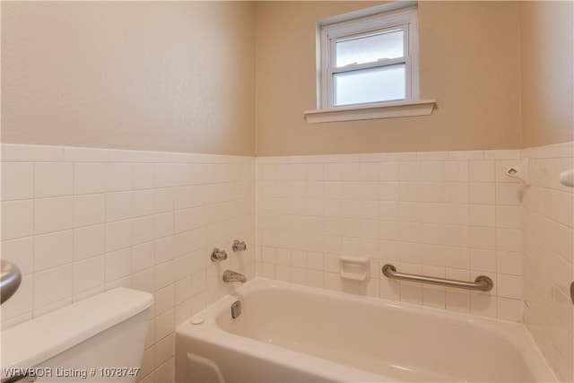 bathroom with a bath and toilet