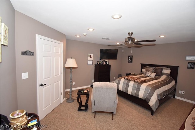 bedroom featuring light carpet, recessed lighting, baseboards, and ceiling fan