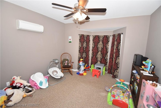 recreation room featuring a wall mounted AC, carpet, ceiling fan, and baseboards