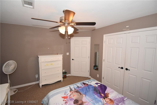 bedroom featuring dark carpet, a closet, baseboards, and ceiling fan