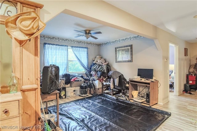 rec room with ceiling fan and light hardwood / wood-style floors