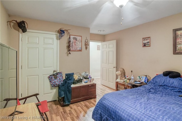 bedroom with light hardwood / wood-style flooring and ceiling fan