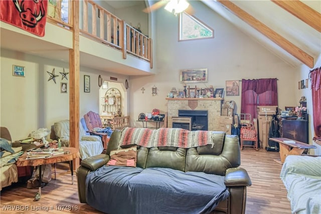 living room featuring beam ceiling, ceiling fan, high vaulted ceiling, and wood-type flooring