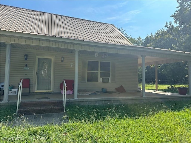 rear view of house with covered porch