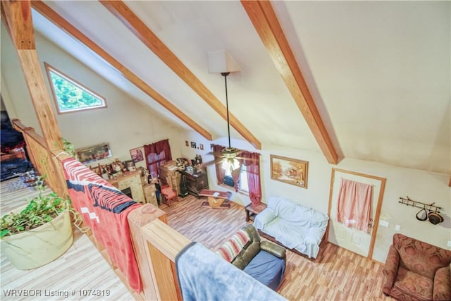 living room with vaulted ceiling with beams, ceiling fan, and wood-type flooring