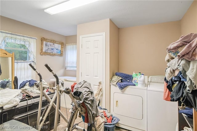 laundry room featuring washing machine and clothes dryer