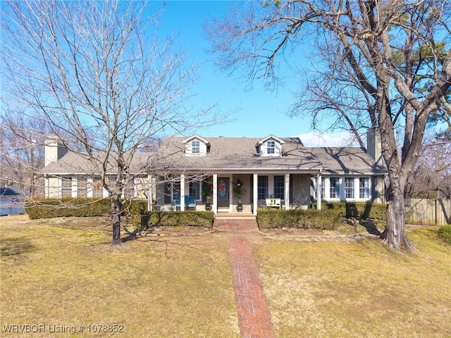 view of front of house with a front lawn and covered porch