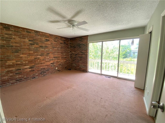 1500 S Albert Pike Ave Unit 40, Fort Smith, AR 72903 - carpeted spare room featuring brick wall, ceiling fan, and a textured ceiling