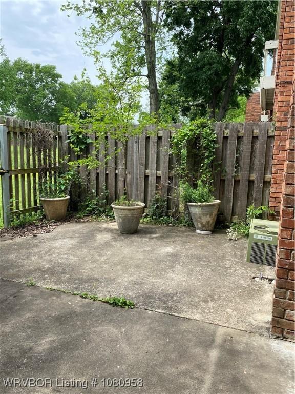 1500 S Albert Pike Ave Unit 40, Fort Smith, AR 72903 - view of patio / terrace with fence and central AC