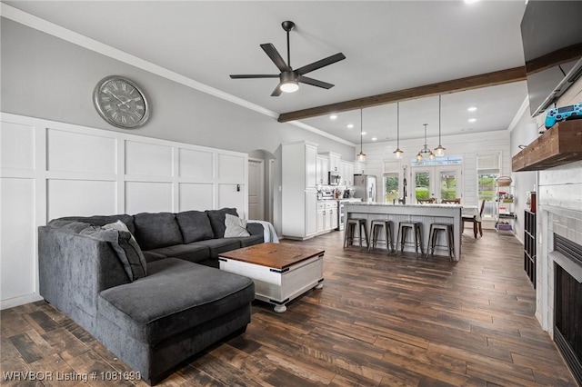 2207 Lisa Ln, Van Buren, AR 72956 - living room featuring ceiling fan, a fireplace, crown molding, recessed lighting, and dark wood-type flooring
