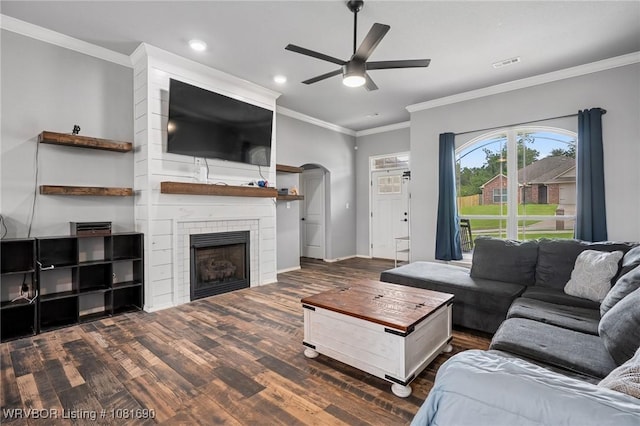 2207 Lisa Ln, Van Buren, AR 72956 - living area with a ceiling fan, wood finished floors, crown molding, a tile fireplace, and recessed lighting