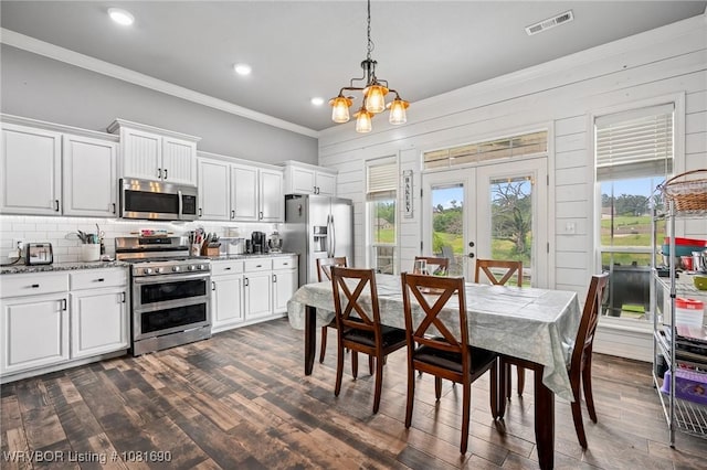 2207 Lisa Ln, Van Buren, AR 72956 - dining area featuring crown molding, a chandelier, dark wood-style flooring, french doors, and recessed lighting
