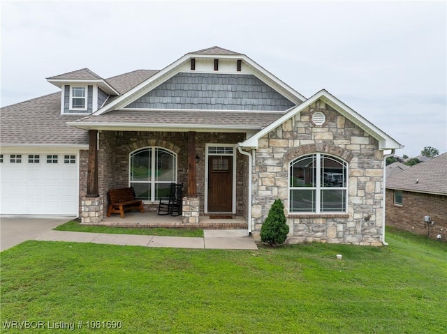 2207 Lisa Ln, Van Buren, AR 72956 - craftsman-style home with stone siding, an attached garage, a porch, and a front lawn