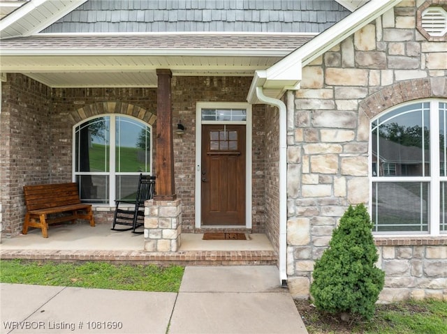 2207 Lisa Ln, Van Buren, AR 72956 - doorway to property with stone siding and a porch