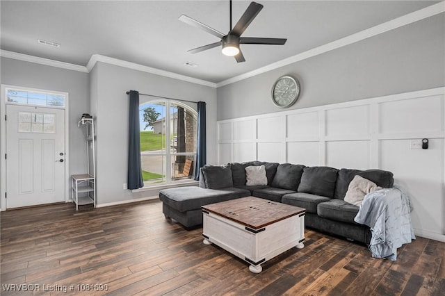 2207 Lisa Ln, Van Buren, AR 72956 - living room featuring dark wood-style flooring, plenty of natural light, a decorative wall, ceiling fan, and crown molding