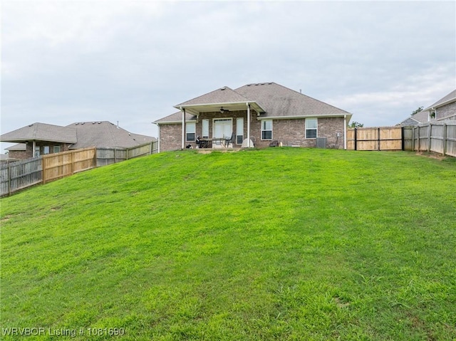 2207 Lisa Ln, Van Buren, AR 72956 - rear view of property featuring a fenced backyard, a ceiling fan, a patio, and brick siding