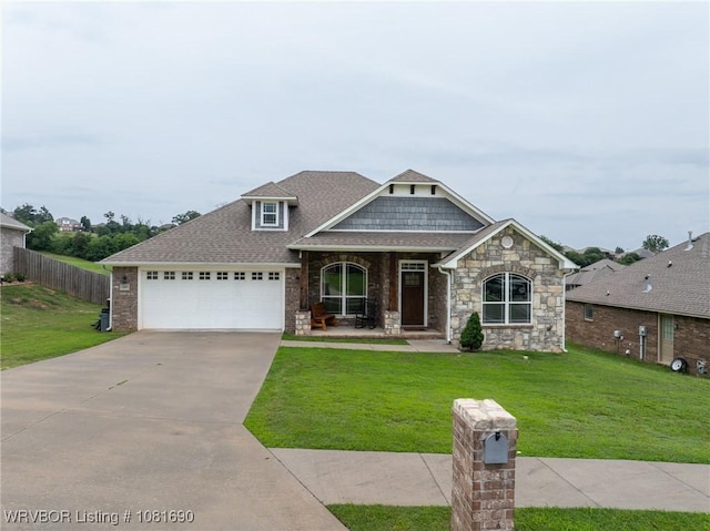 2207 Lisa Ln, Van Buren, AR 72956 - craftsman house with an attached garage, concrete driveway, a porch, and a shingled roof