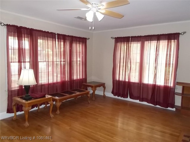 619 N 40th St, Fort Smith, AR 72903 - sitting room featuring ceiling fan, wood finished floors, and baseboards