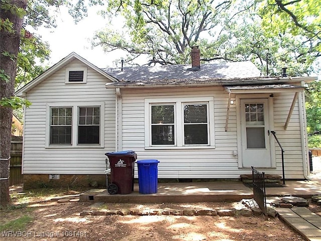 619 N 40th St, Fort Smith, AR 72903 - view of front of home with a chimney, a patio area, crawl space, and entry steps