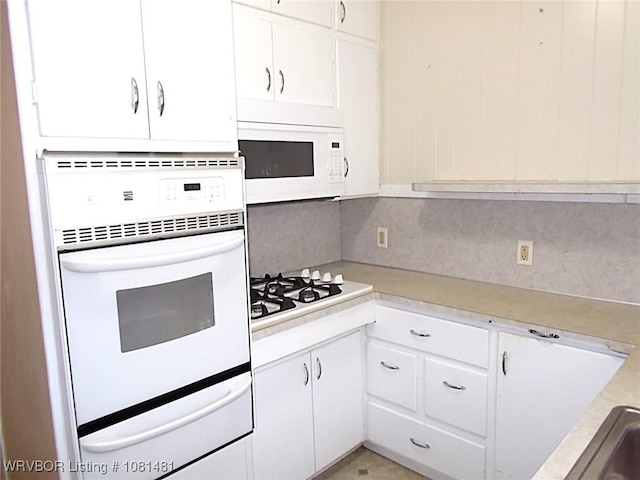 619 N 40th St, Fort Smith, AR 72903 - kitchen with a warming drawer, white appliances, light countertops, and white cabinets