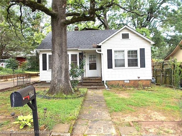 619 N 40th St, Fort Smith, AR 72903 - view of front of house featuring entry steps, crawl space, a shingled roof, and a chimney