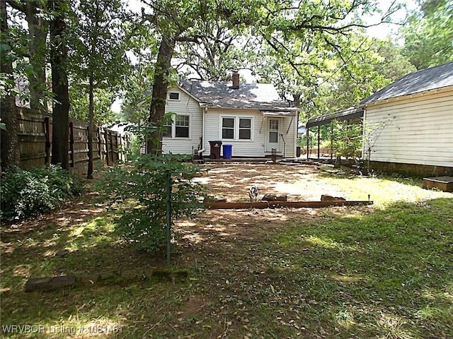 619 N 40th St, Fort Smith, AR 72903 - rear view of house featuring a chimney