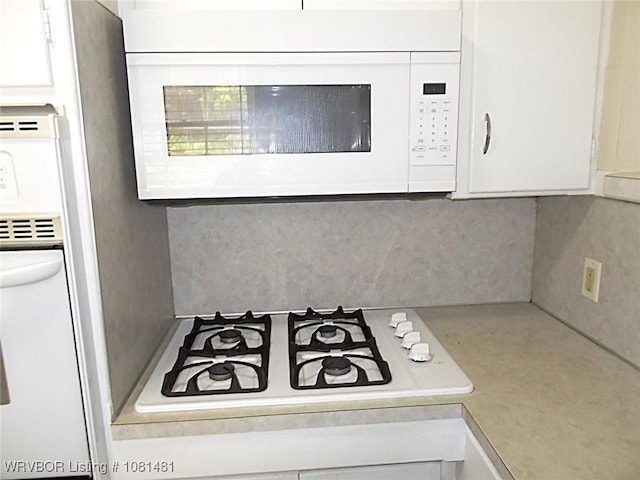 619 N 40th St, Fort Smith, AR 72903 - kitchen view of white appliances, white cabinets, and light countertops