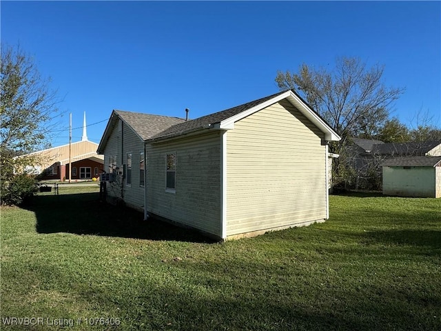 view of property exterior with a lawn