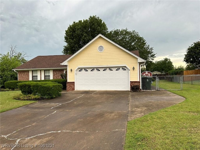 5108 S 94th St, Fort Smith, AR 72903 - ranch-style house with brick siding, concrete driveway, an attached garage, and a gate