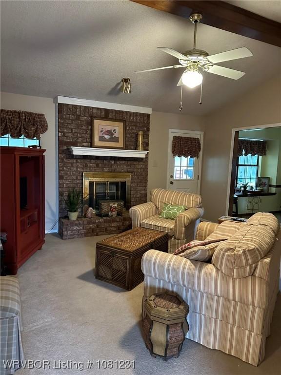 5108 S 94th St, Fort Smith, AR 72903 - carpeted living room featuring plenty of natural light, a ceiling fan, and a fireplace