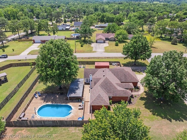 aerial view of property and surrounding area featuring a pool area